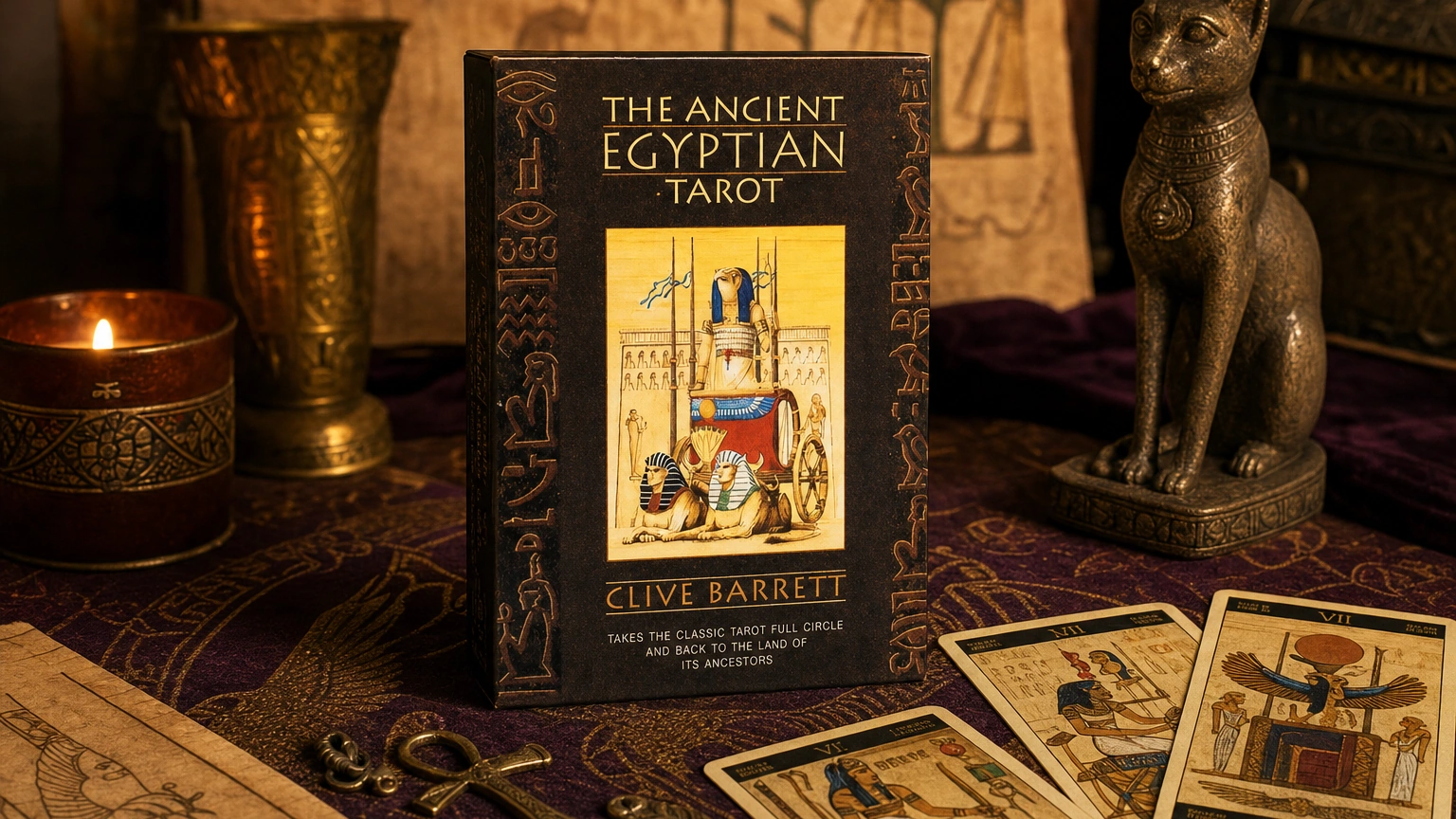 Ancient Egyptian Tarot product box lifestyle image The Ancient Egyptian Tarot product box on a plum and gold Egyptian tarot table