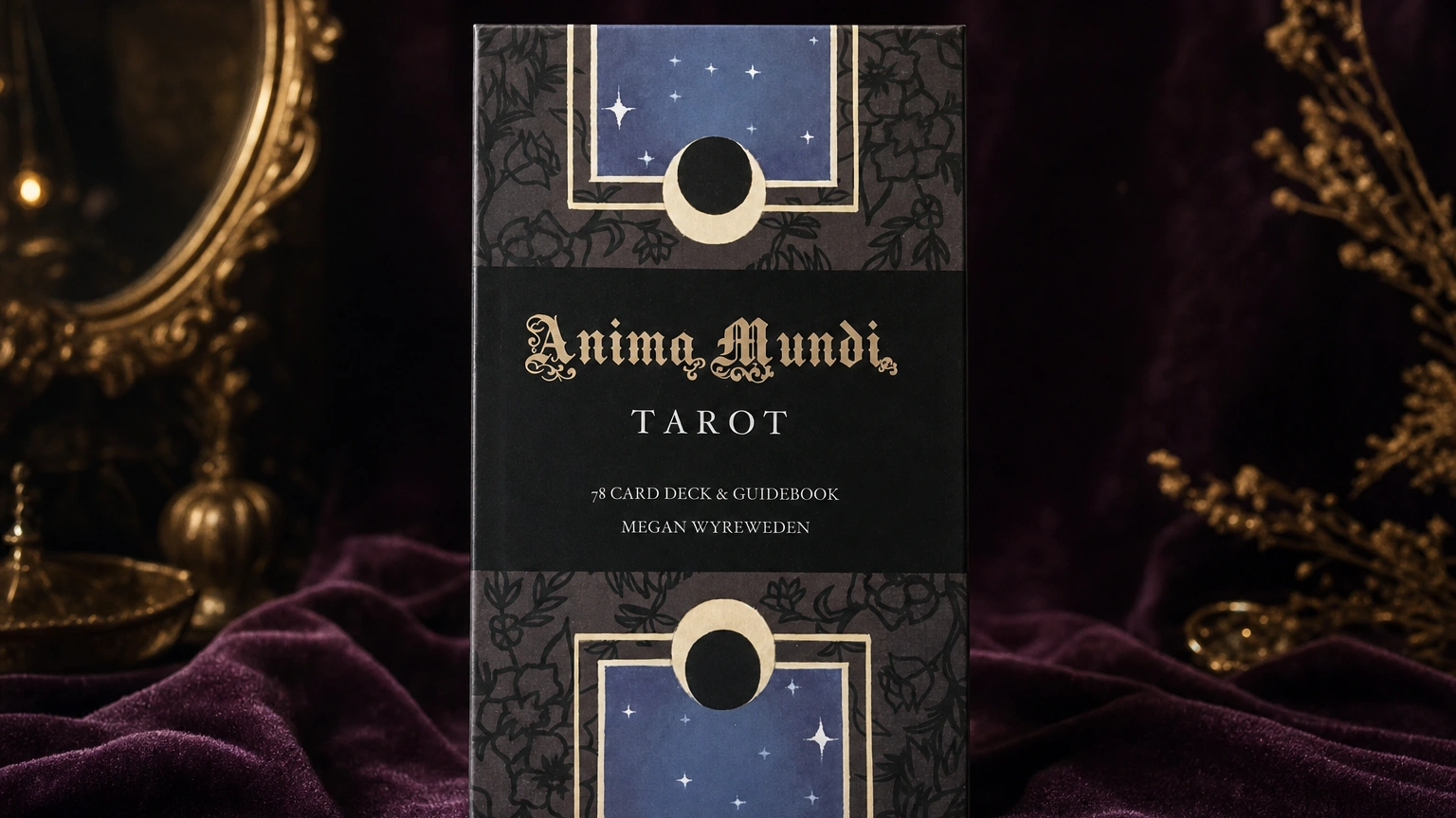 Anima Mundi Tarot product box lifestyle image Anima Mundi Tarot product box on a plum and gold TarotFans table