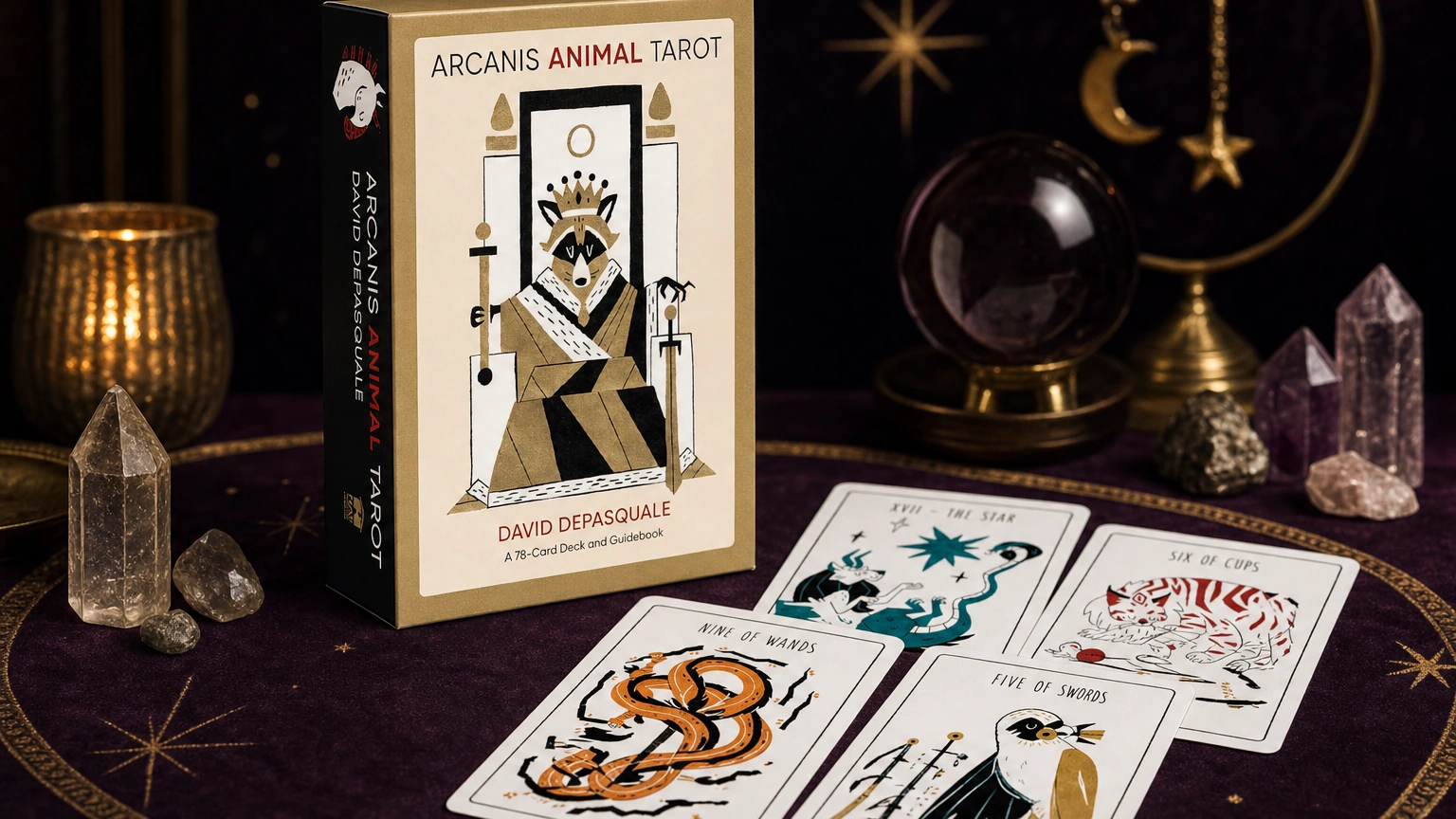 Arcanis Animal Tarot product box and cards on a plum and gold tarot table Arcanis Animal Tarot product box and cards on a plum and gold tarot table
