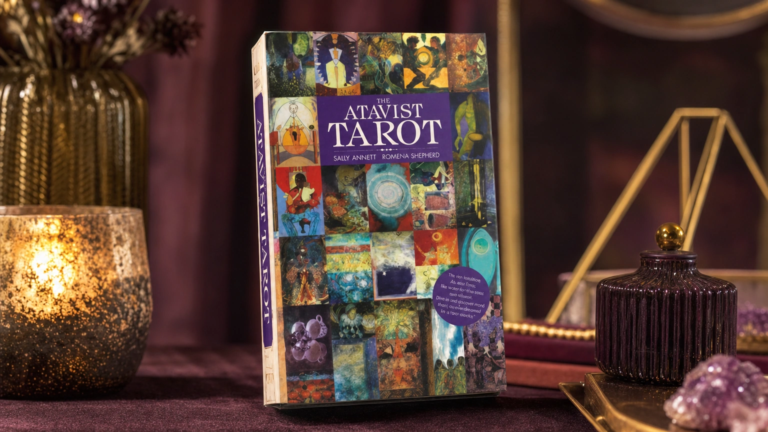 Atavist Tarot product box lifestyle image Atavist Tarot product box in a plum and gold lifestyle scene