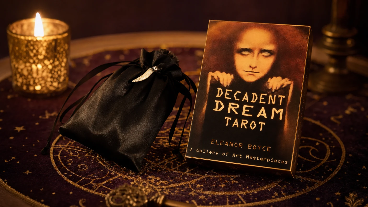 Decadent Dreams Tarot box and black pouch on a plum and gold tarot table