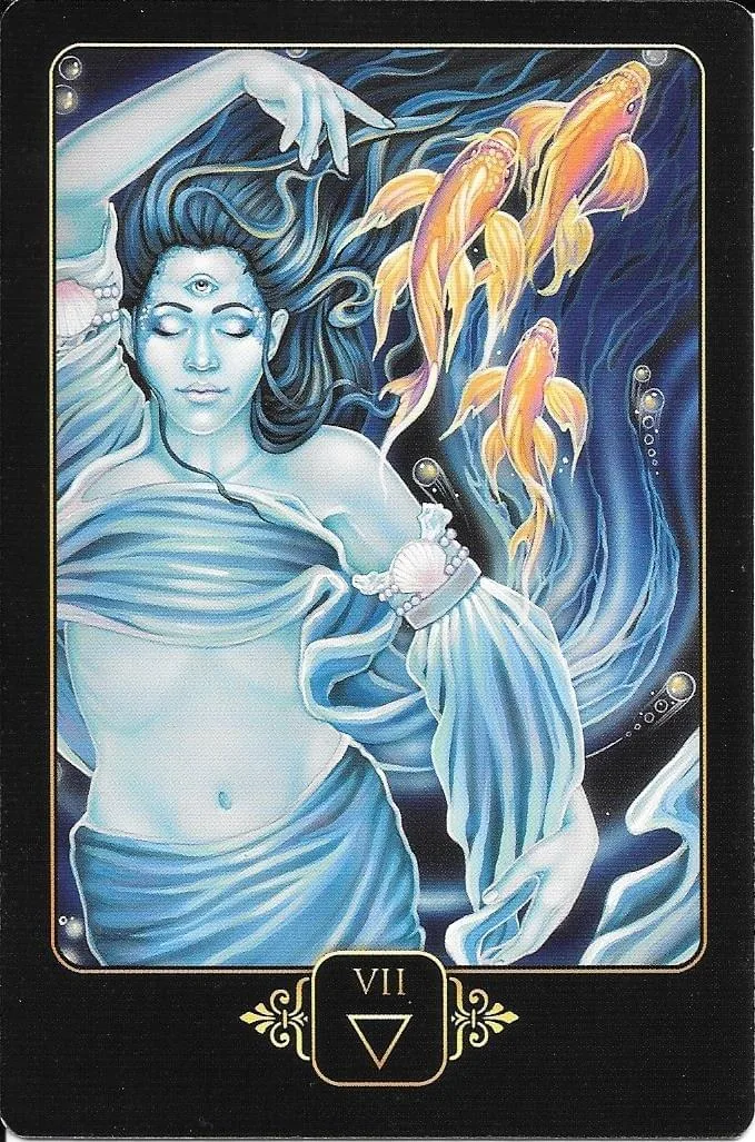 Dreams of Gaia Tarot Review 11 7 of Water card from Dreams of Gaia Tarot, showing a serene submerged figure with a third eye, flowing hands, shells, bubbles, and ascending golden fish