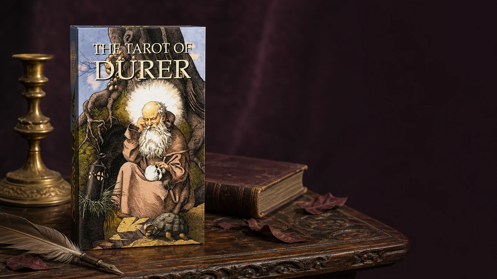 The Tarot of Durer product lifestyle image The Tarot of Durer product box on a carved Renaissance-style table with a brass candleholder, quill, and antique book