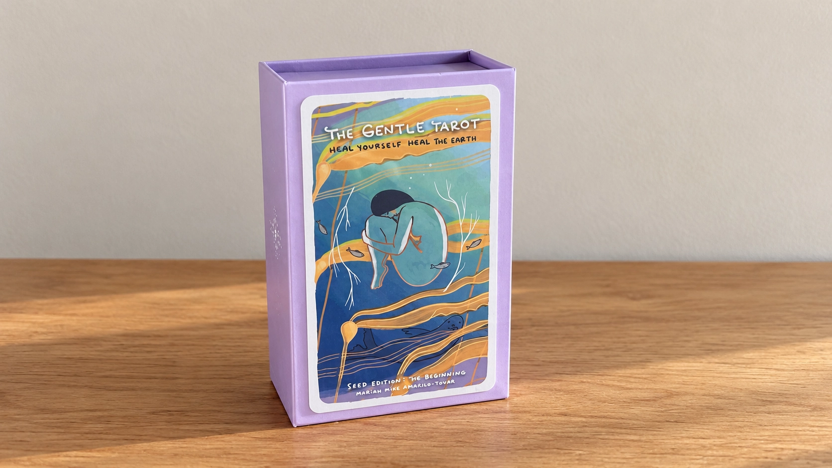 AI-generated editorial scene of The Gentle Tarot lavender Seed Edition box on a plain table