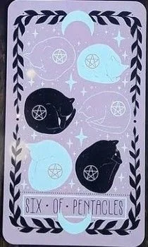 6 of Pentacles card from the Lovely Omens Tarot deck