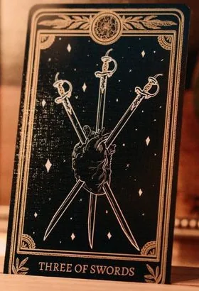 Three of Swords card from the Marigold Tarot deck