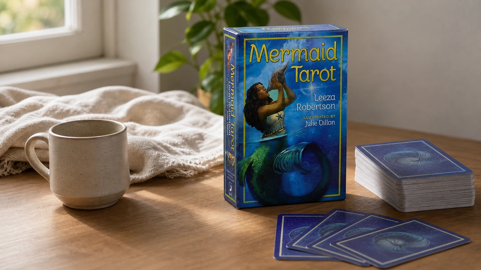Mermaid Tarot Review 21 Reference-guided modern home scene featuring the Mermaid Tarot box by Leeza Robertson