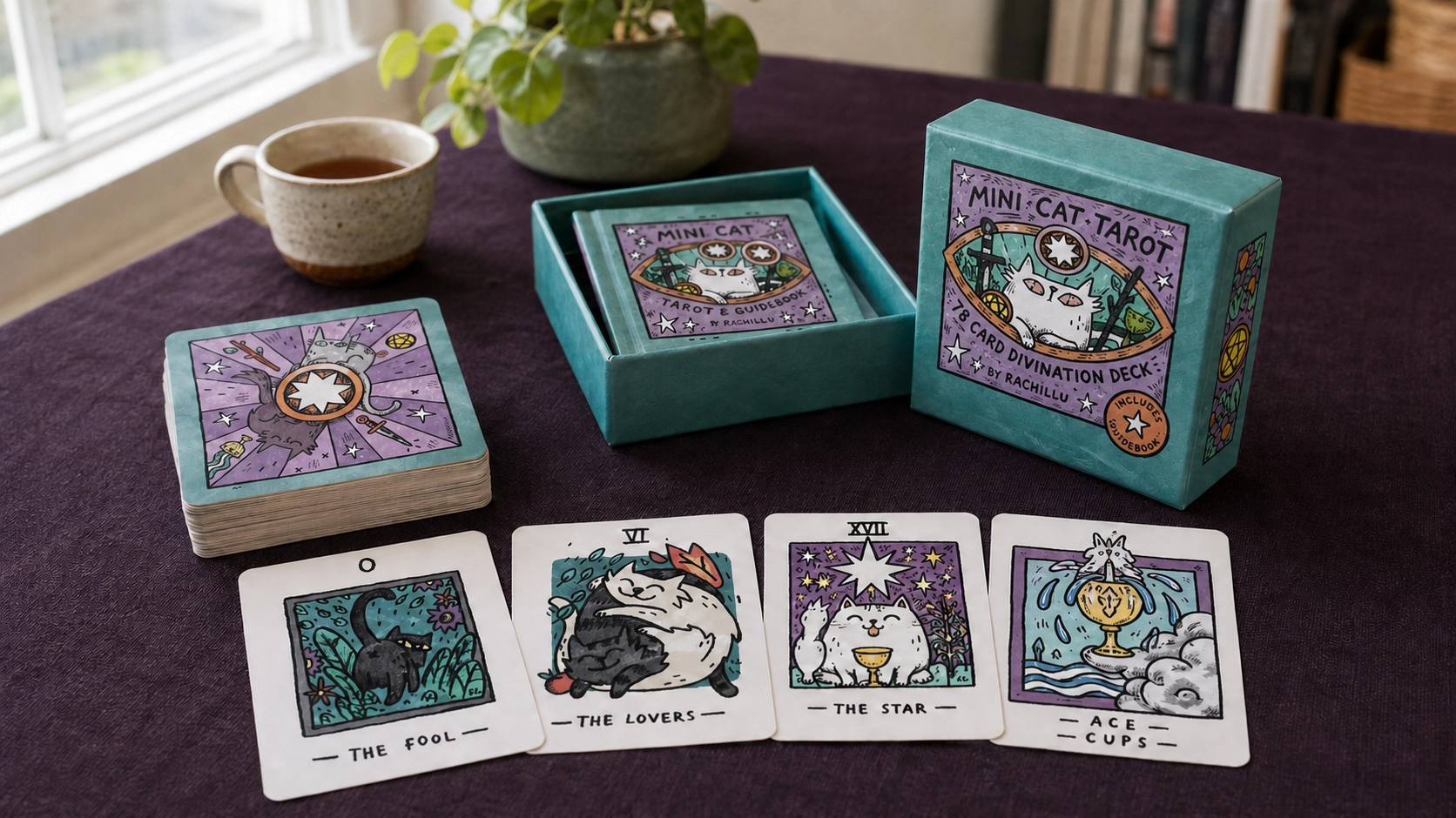 Generated lifestyle scene showing the Mini Cat Tarot box by Rachillu, guidebook, stacked deck and four cards on plum velvet
