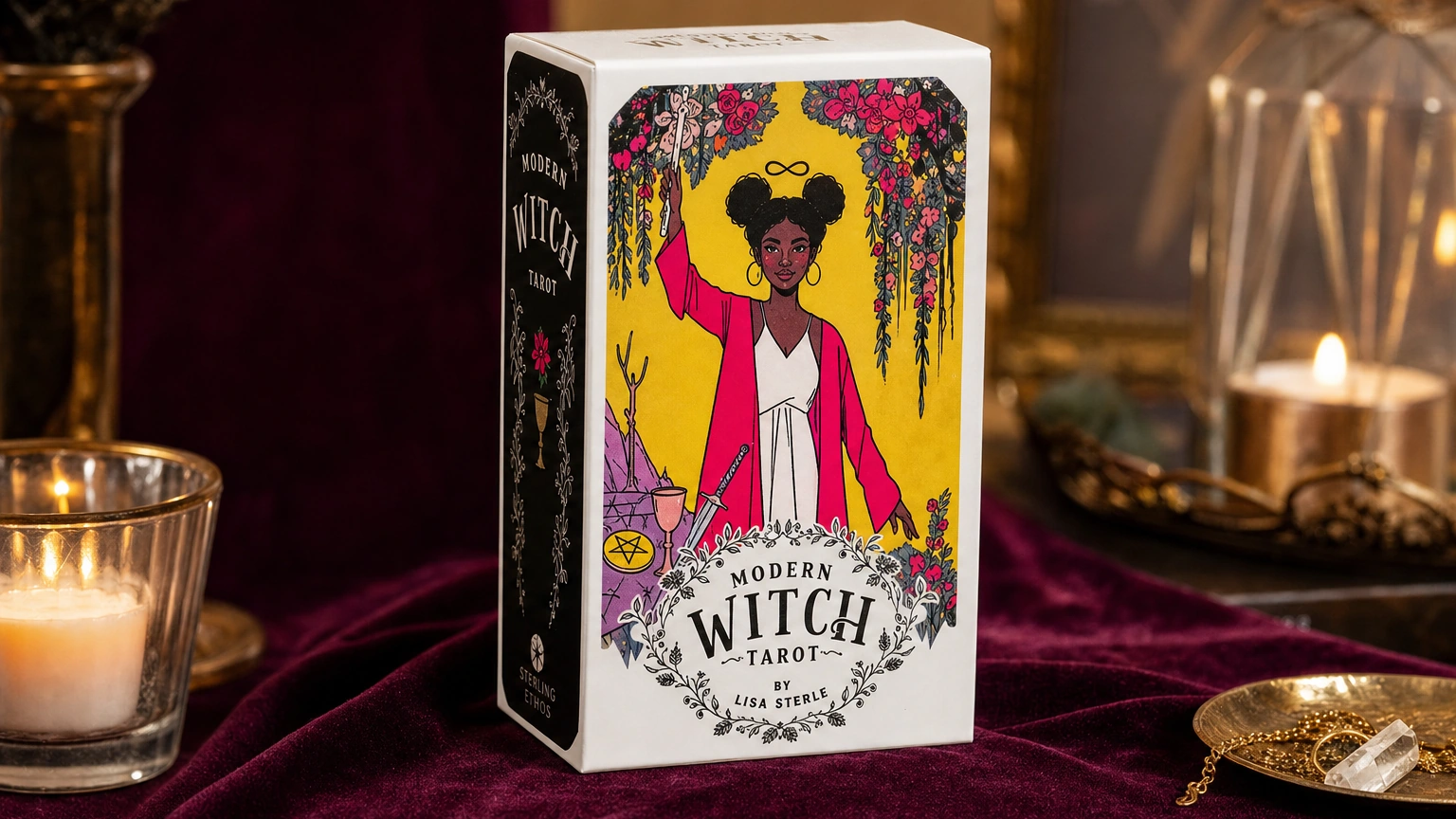 Modern Witch Tarot deck box in a warm candlelit lifestyle scene