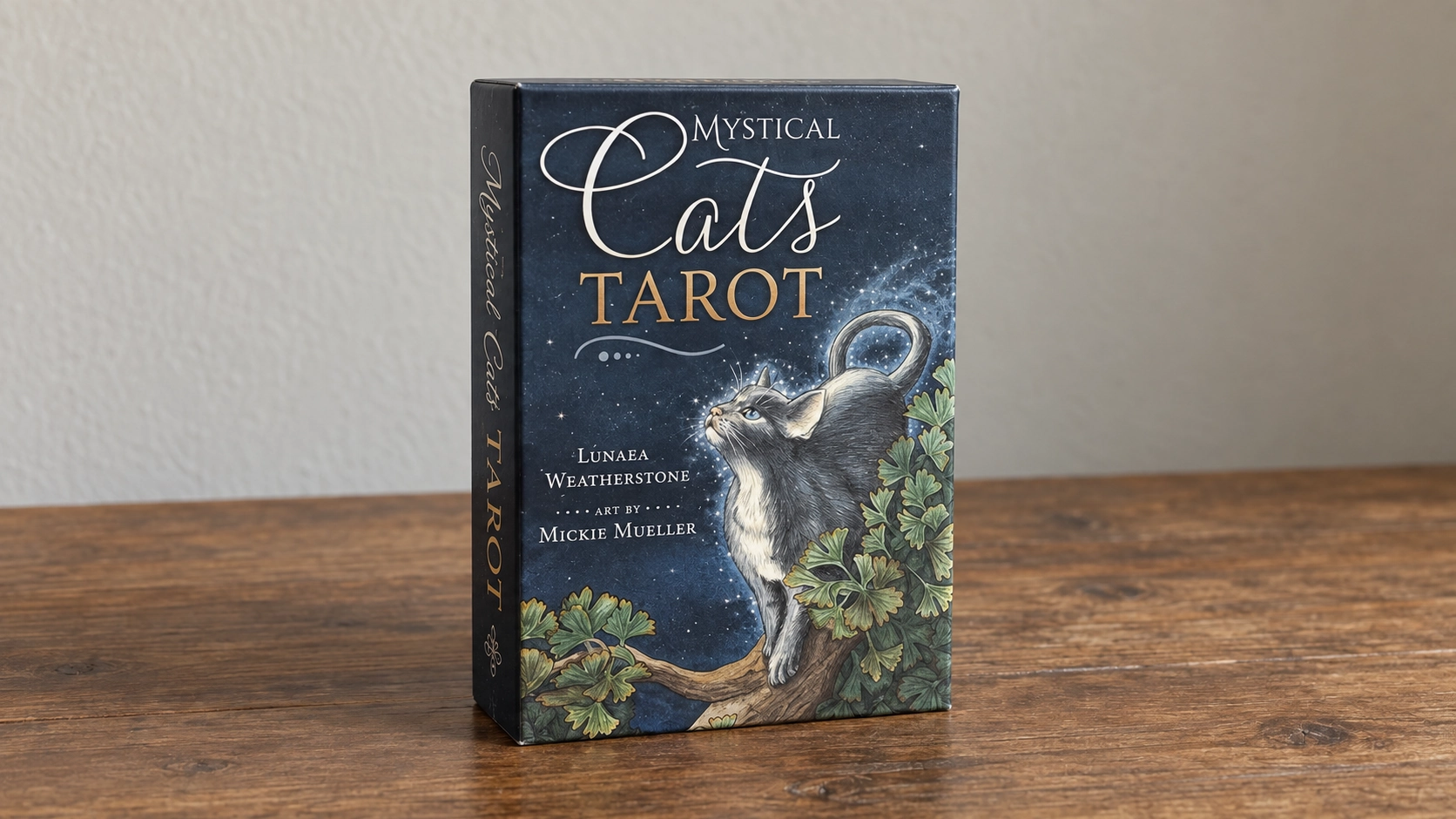Generated daylight scene of the exact Mystical Cats Tarot boxed kit alone on a wooden table
