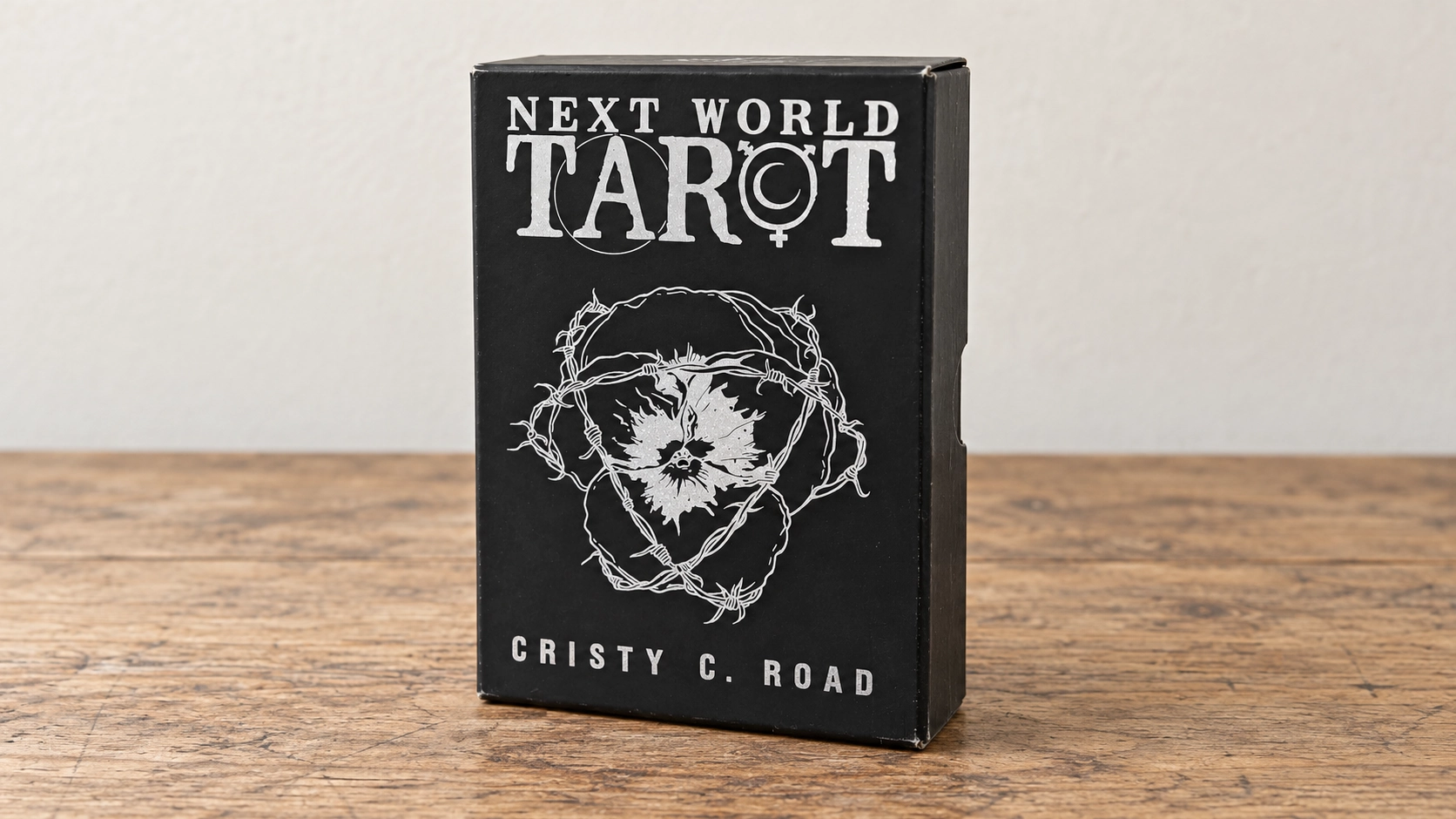 Next World Tarot Deck by Cristy C. Road Generated product scene showing the Next World Tarot box by Cristy C. Road on a wooden reading table