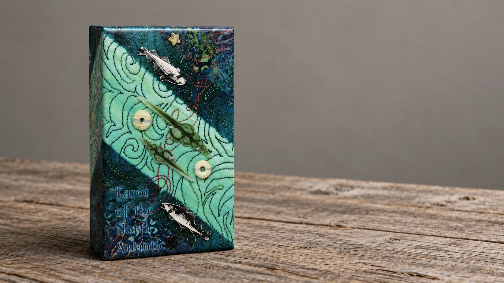 Generated illustration of the Tarot of the North Atlantic box by Lee Thomson standing alone on a wooden table