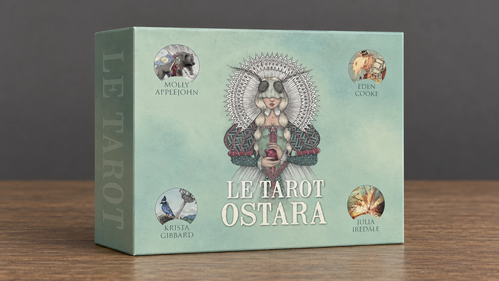 Generated scene of the French LE TAROT OSTARA Deck box by Molly Applejohn, Eden Cooke, Krista Gibbard, and Julia Iredale on a wooden table against a plain charcoal background