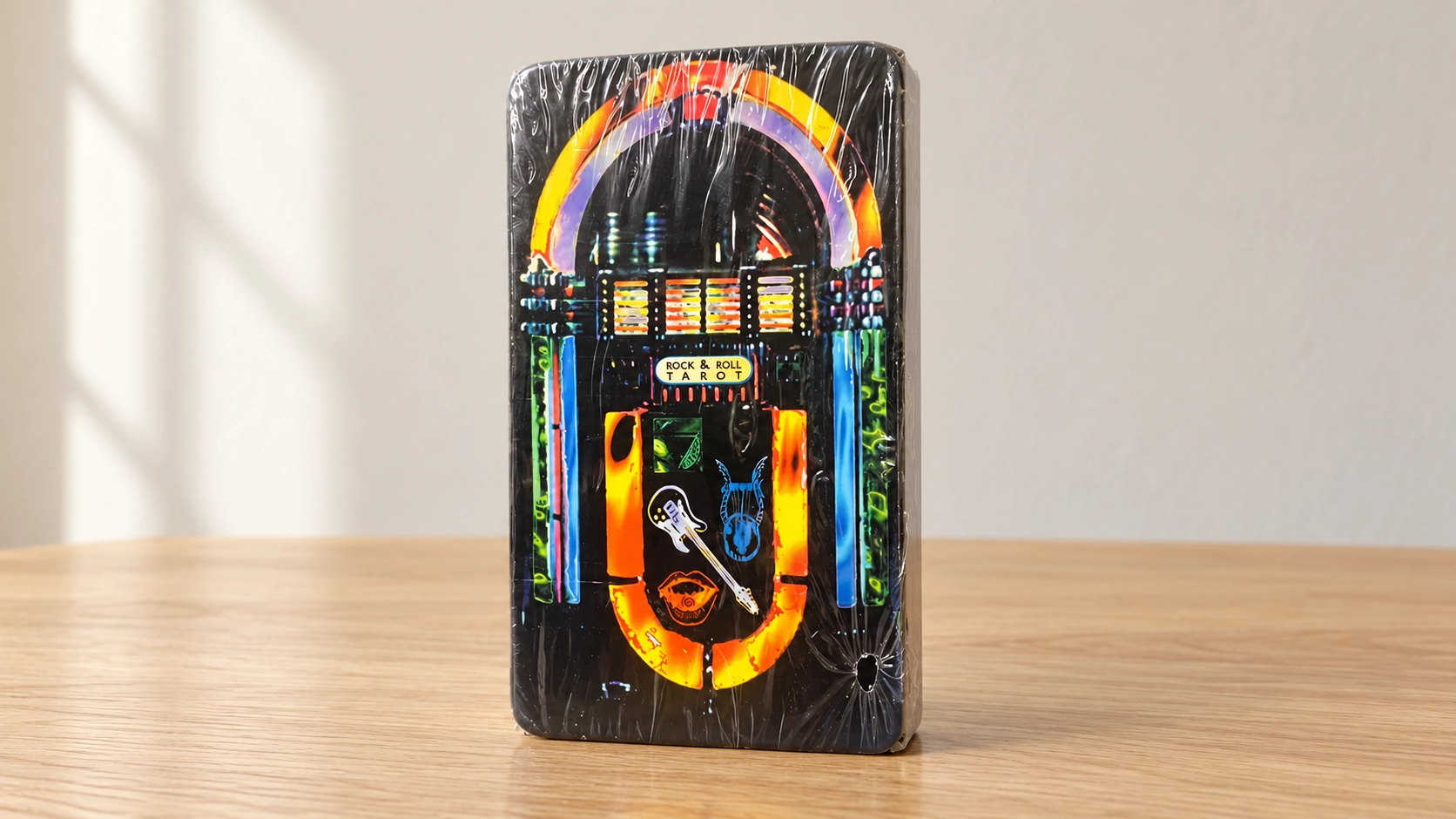Generated product scene of the Rock & Roll Tarot jukebox box standing alone on a simple wooden table