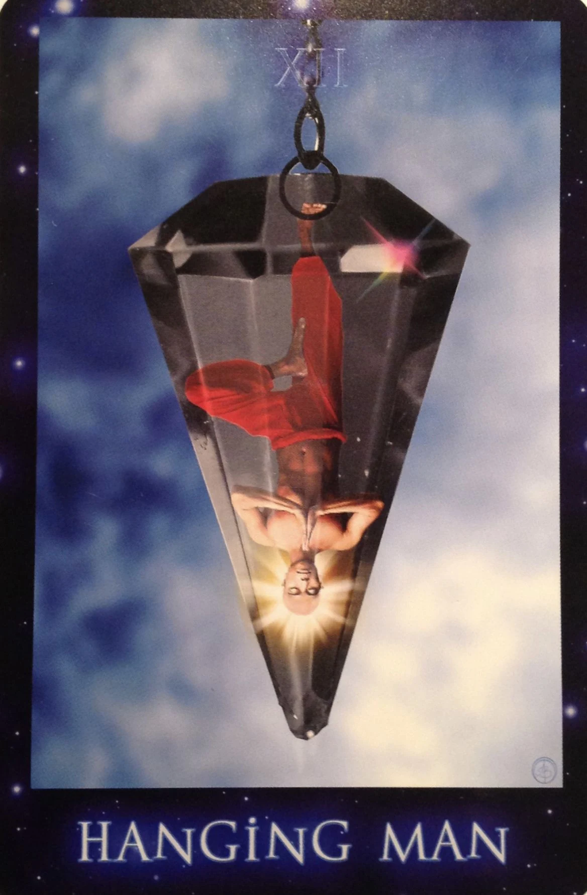 XII Hanging Man card from The Sirian Starseed Tarot deck
