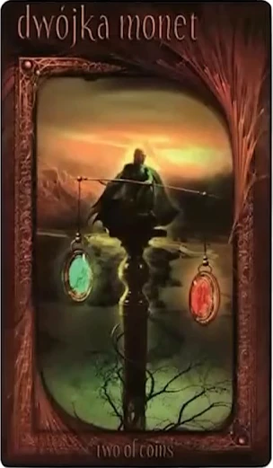 Two of Coins card from the Maroon Tarot deck